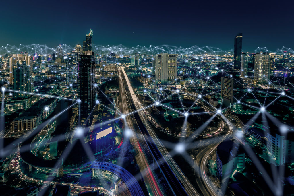 City scene at night illustrating cybersecurity and NERC CIP Compliance